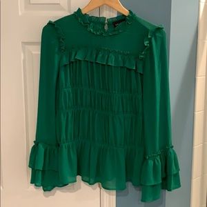 Ruffled green blouse